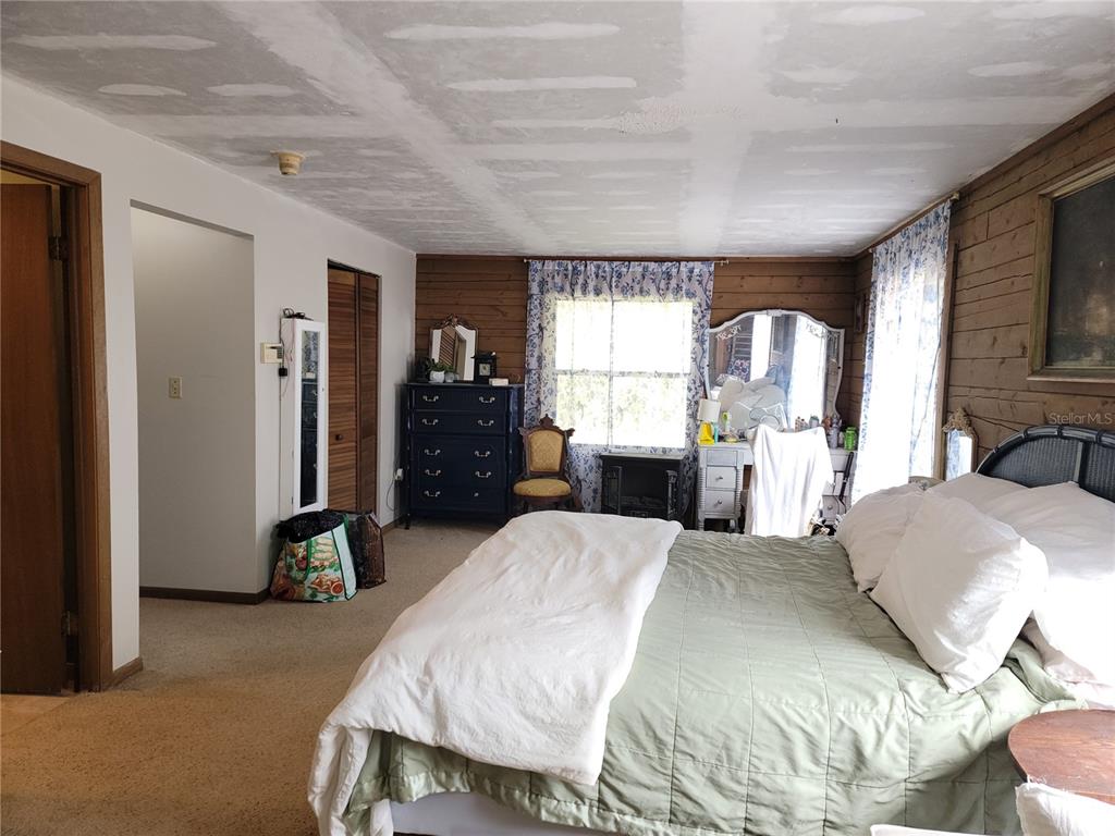 1600 Southwest 42nd Street Ocala, FL 34471 - Photo 16 of 39 a large bedroom with a large bed and furniture