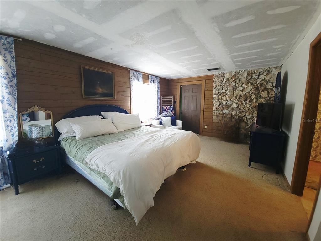 1600 Southwest 42nd Street Ocala, FL 34471 - Photo 18 of 39 a bedroom with a bed and a window