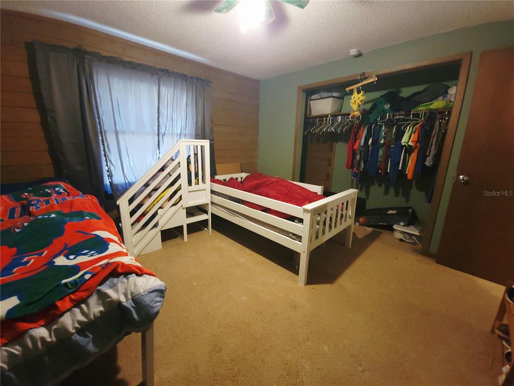 1600 Southwest 42nd Street Ocala, FL 34471 - Photo 20 of 39 a bedroom with a bed and a window