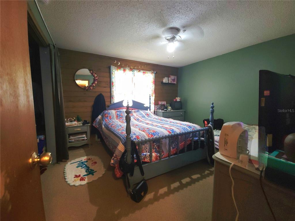 1600 Southwest 42nd Street Ocala, FL 34471 - Photo 22 of 39 a bedroom with a bed and window