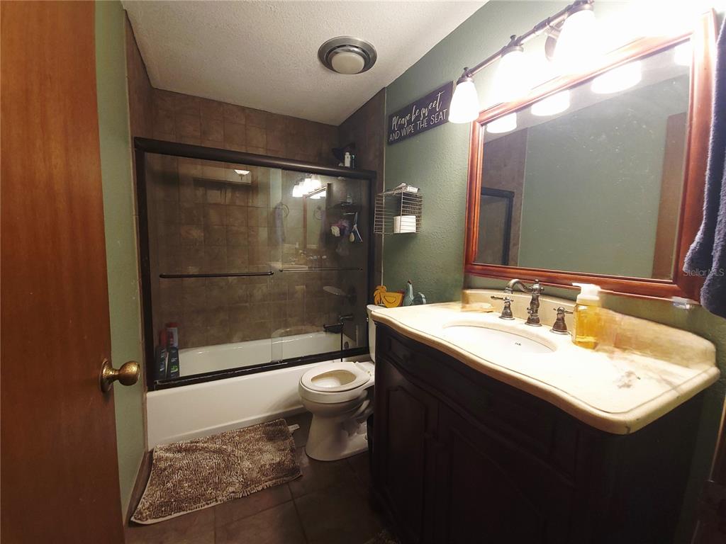 1600 Southwest 42nd Street Ocala, FL 34471 - Photo 23 of 39 a bathroom with a sink toilet and shower