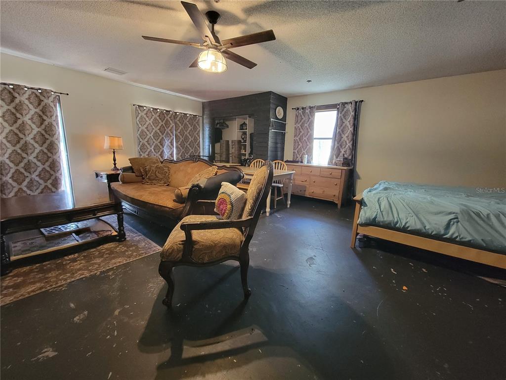 1600 Southwest 42nd Street Ocala, FL 34471 - Photo 24 of 39 a bedroom with furniture and a window