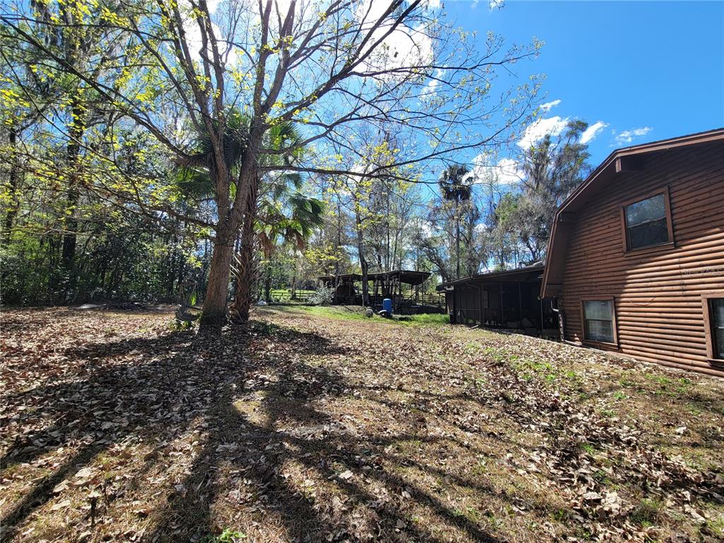 1600 Southwest 42nd Street Ocala, FL 34471 - Photo 27 of 39 a view of a house with a yard