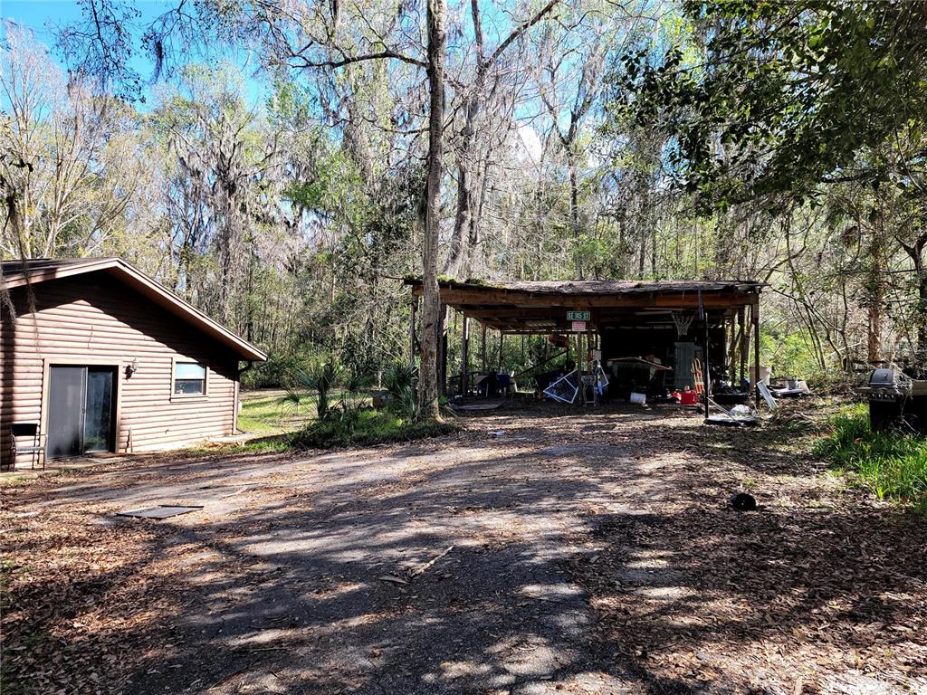 1600 Southwest 42nd Street Ocala, FL 34471 - Photo 28 of 39 a view of a house with a yard and garage
