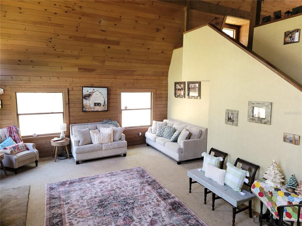 1600 Southwest 42nd Street Ocala, FL 34471 - Photo 3 of 39 a living room with furniture and a couch