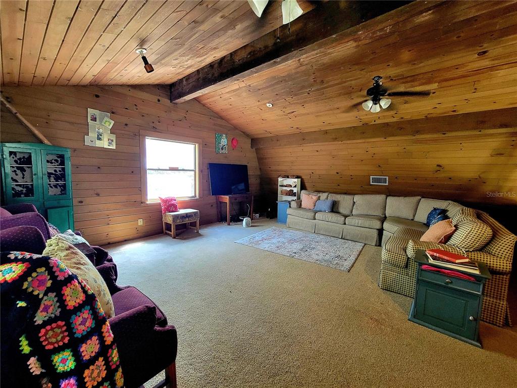 1600 Southwest 42nd Street Ocala, FL 34471 - Photo 9 of 39 a bedroom with furniture and window