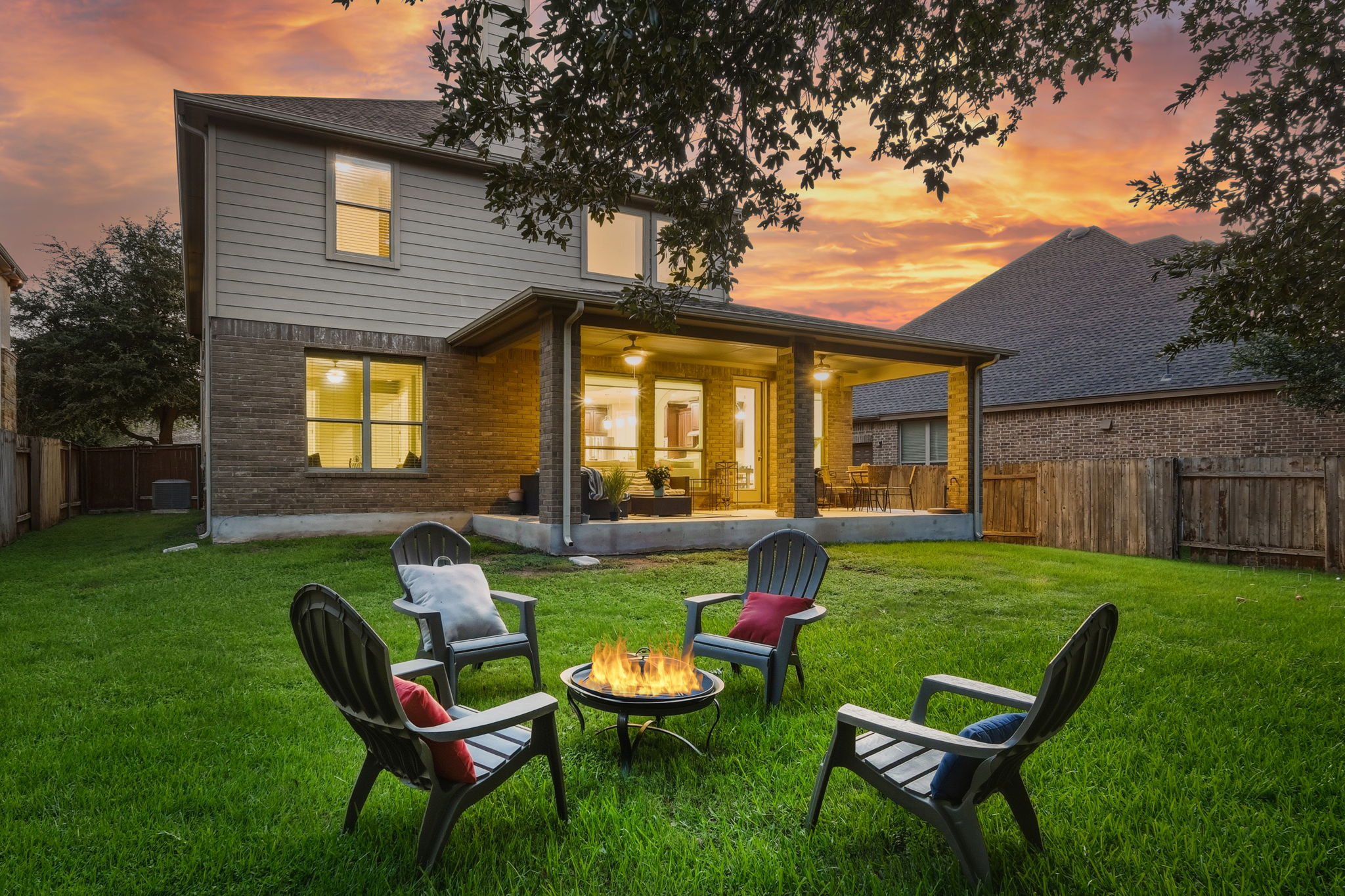 110 Dasher Drive Cedar Park, TX 78613 - Photo 17 of 39 A vibrant backyard with a covered patio offers ample space for outdoor living and entertaining.