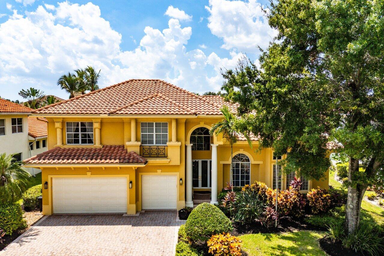7094 Vía Mediterrania Boca Raton, FL 33433 - Photo 1 of 46 a front view of a house with a garden