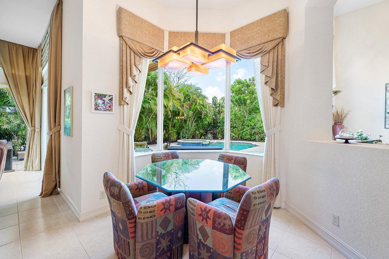 7094 Vía Mediterrania Boca Raton, FL 33433 - Photo 15 of 46 a view of a dining room with furniture window and outside view