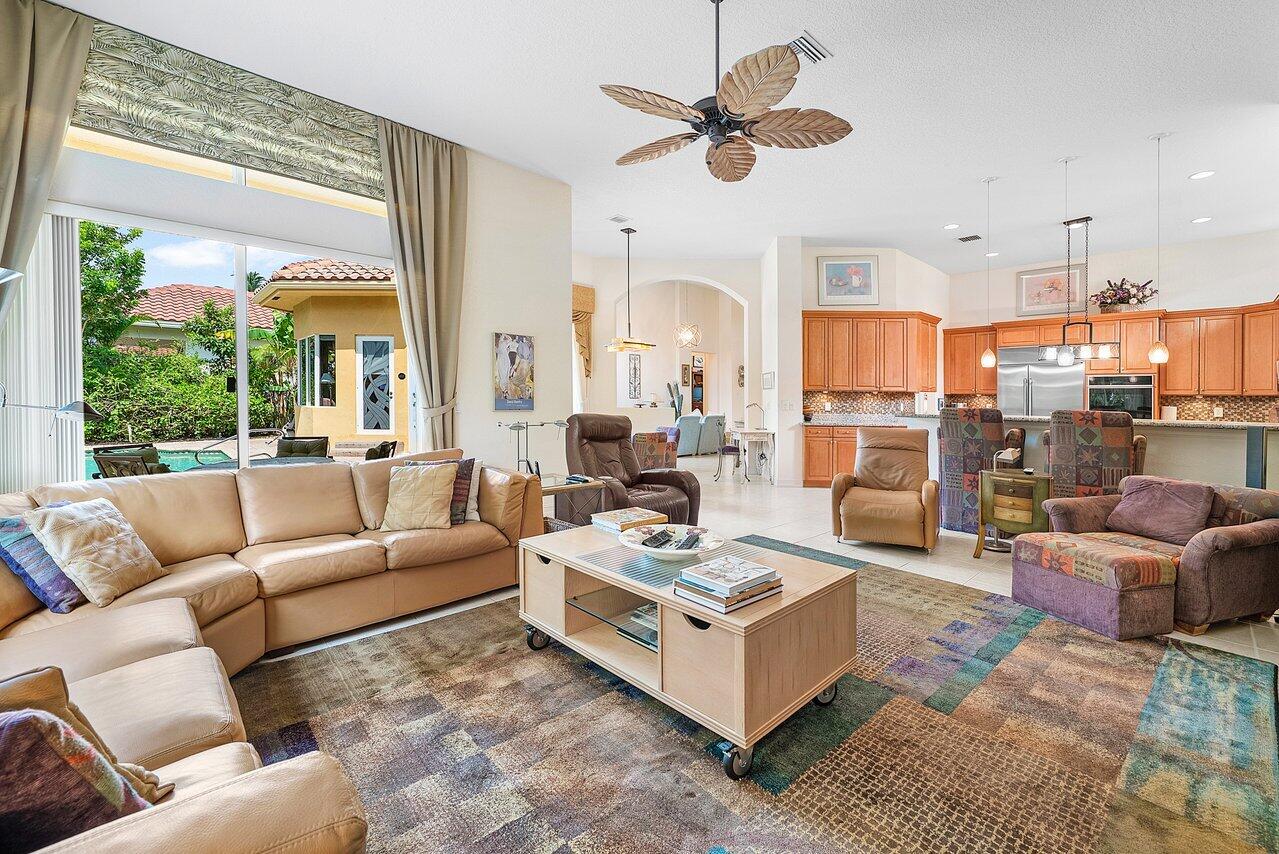 7094 Vía Mediterrania Boca Raton, FL 33433 - Photo 17 of 46 a living room with furniture kitchen view and a large window