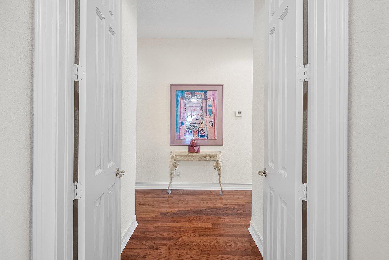 7094 Vía Mediterrania Boca Raton, FL 33433 - Photo 23 of 46 a view of a hallway with wooden floor and closet