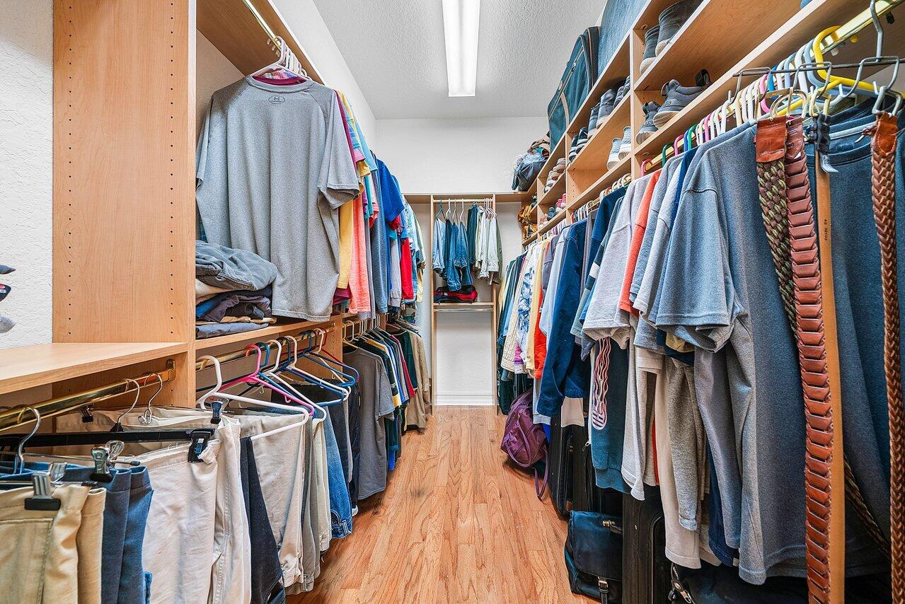 7094 Vía Mediterrania Boca Raton, FL 33433 - Photo 27 of 46 a view of walk in closet with clothes and shoes