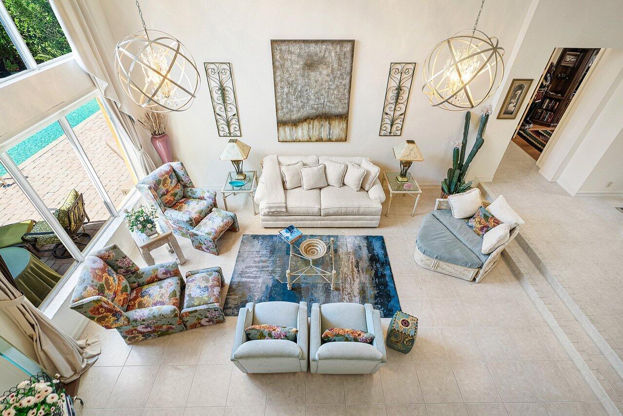 7094 Vía Mediterrania Boca Raton, FL 33433 - Photo 31 of 46 a living room with furniture and a flat screen tv