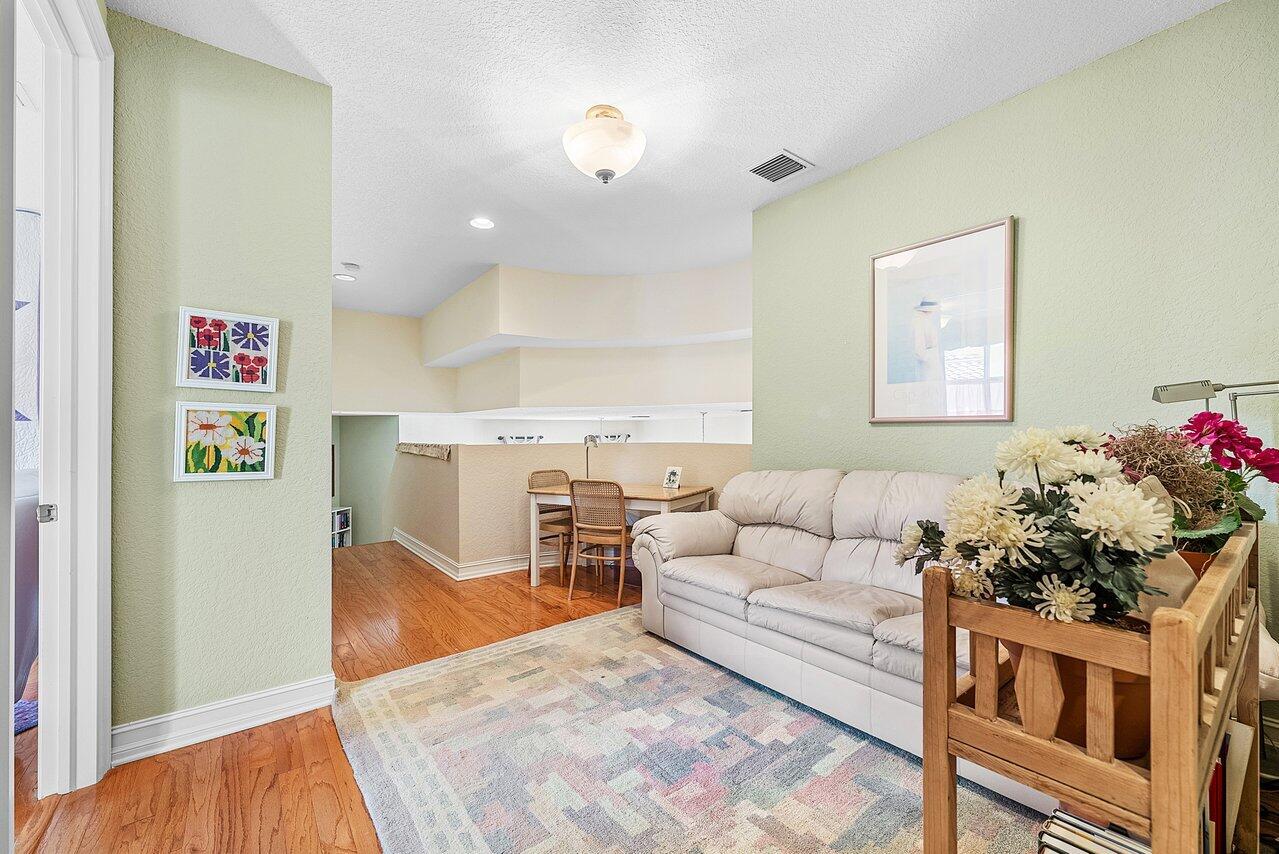 7094 Vía Mediterrania Boca Raton, FL 33433 - Photo 33 of 46 a living room with furniture and flowers