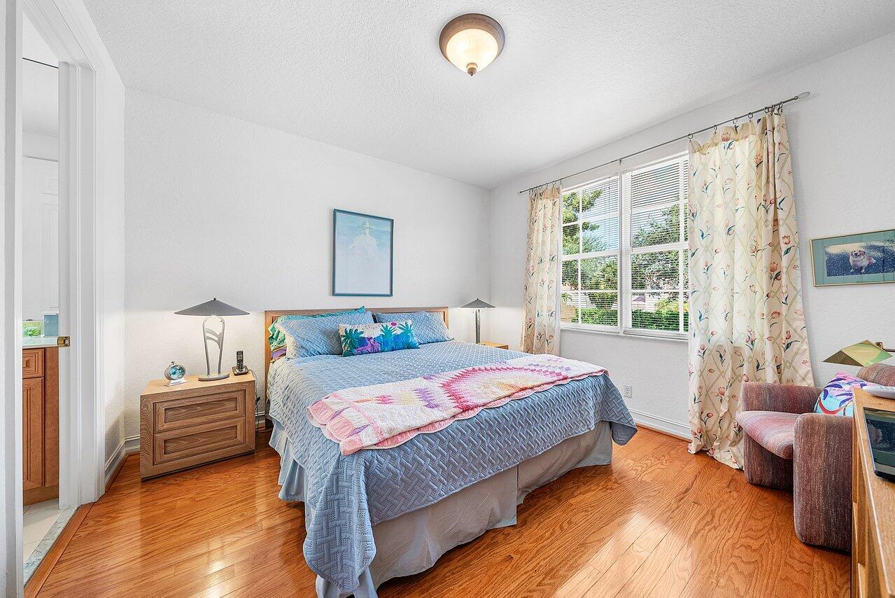 7094 Vía Mediterrania Boca Raton, FL 33433 - Photo 34 of 46 a bedroom with a bed and a window