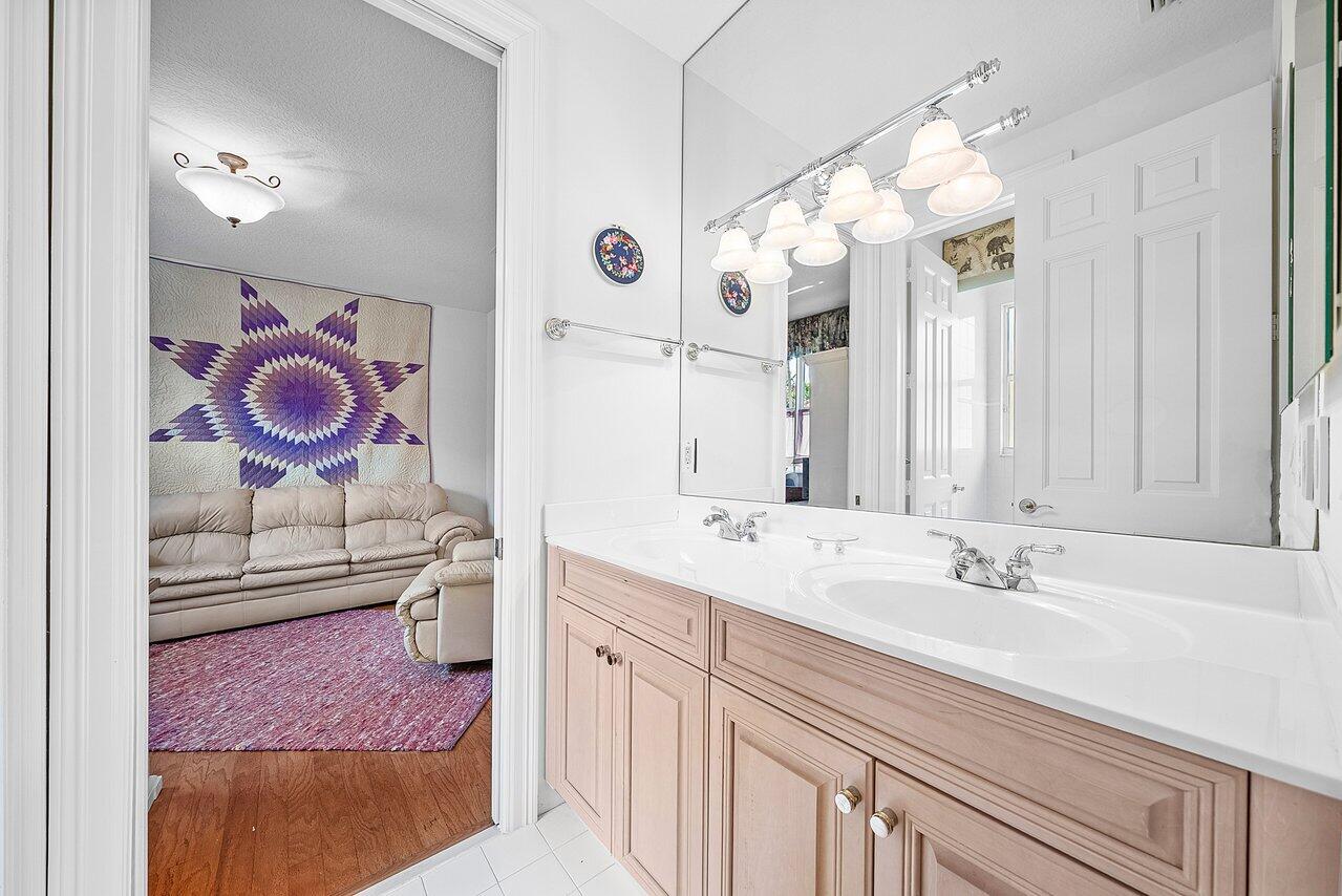7094 Vía Mediterrania Boca Raton, FL 33433 - Photo 38 of 46 a bathroom with a sink and a mirror