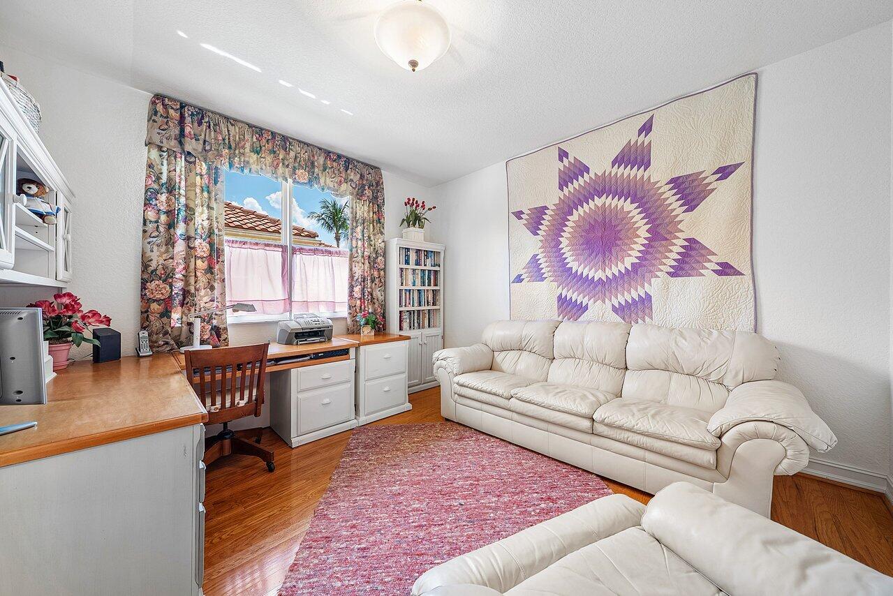 7094 Vía Mediterrania Boca Raton, FL 33433 - Photo 39 of 46 a living room with furniture and a large window