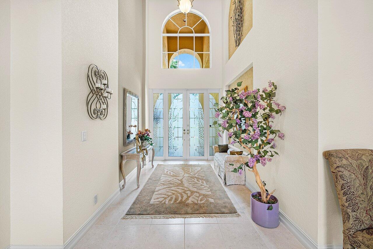 7094 Vía Mediterrania Boca Raton, FL 33433 - Photo 4 of 46 an entryway with a flower pot and a potted plant