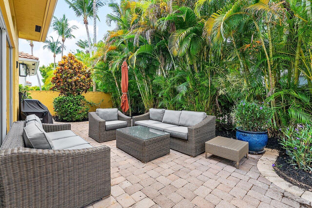 7094 Vía Mediterrania Boca Raton, FL 33433 - Photo 42 of 46 a view of a patio with couches and a potted plant