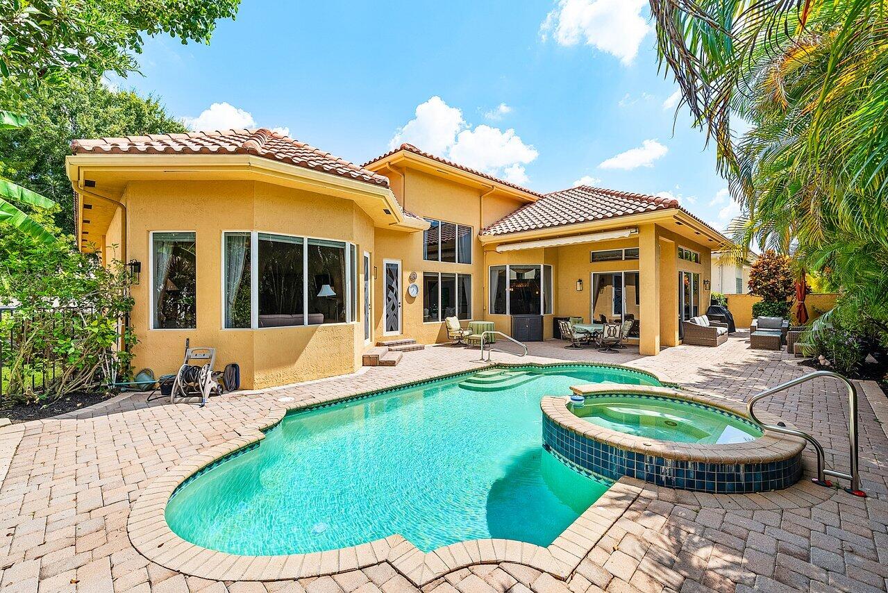 7094 Vía Mediterrania Boca Raton, FL 33433 - Photo 43 of 46 a view of a house with swimming pool and porch