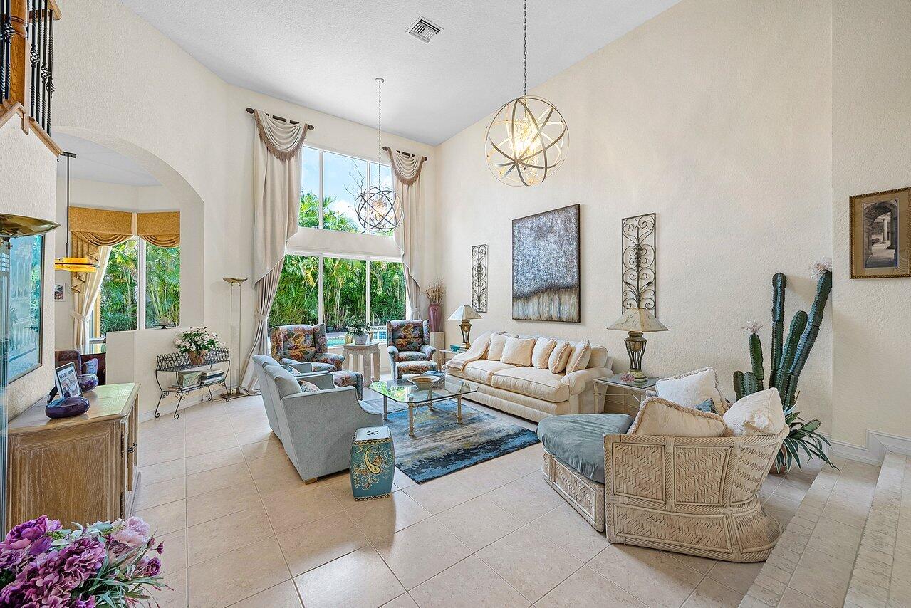 7094 Vía Mediterrania Boca Raton, FL 33433 - Photo 6 of 46 a living room with fireplace furniture and a large window