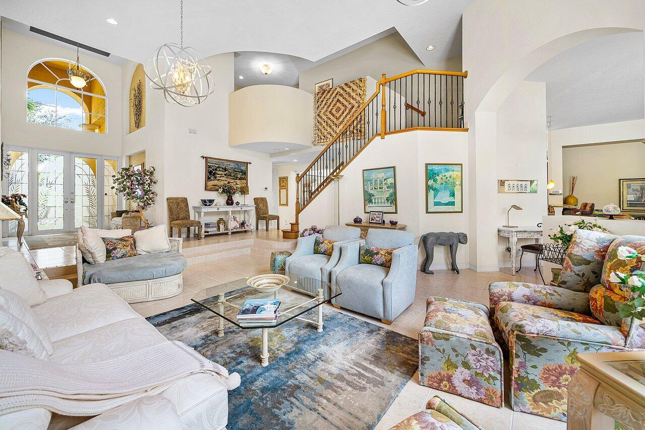 7094 Vía Mediterrania Boca Raton, FL 33433 - Photo 7 of 46 a living room with fireplace furniture and a large window