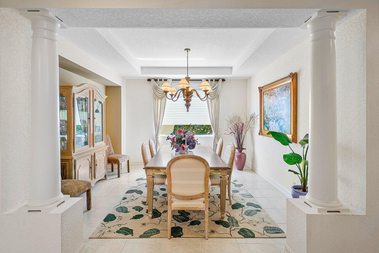 7094 Vía Mediterrania Boca Raton, FL 33433 - Photo 8 of 46 a view of a dining room with furniture window and outside view