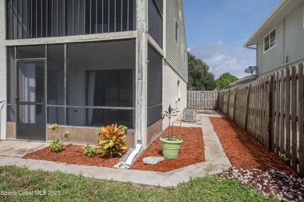 a backyard of a house with yard and outdoor seating