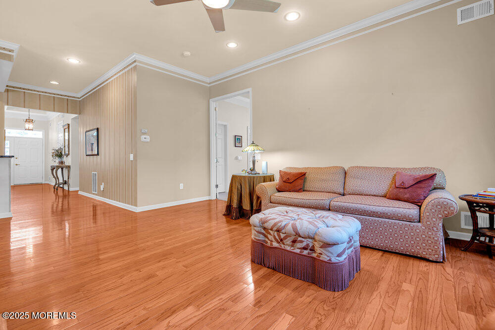 7 Shoal Road Jackson, NJ 08527 - Photo 27 of 67 a living room with furniture and a wooden floor