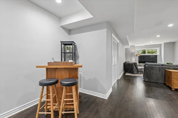 a view of a livingroom with furniture and wooden floor