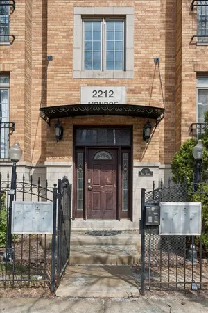 a front view of a building with outdoor seating
