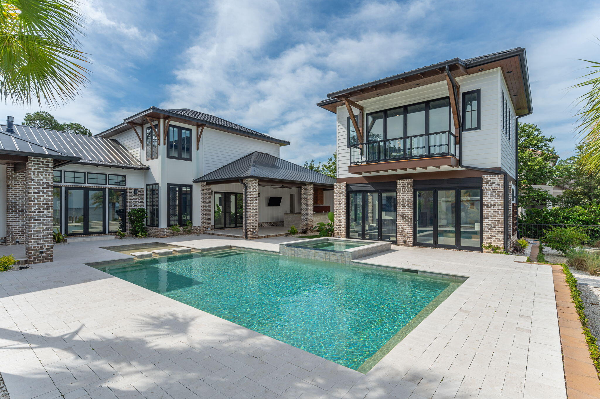 259 Driftwood Point Road Santa Rosa Beach, FL 32459 - Photo 54 of 137 a front view of a house with swimming pool having outdoor seating