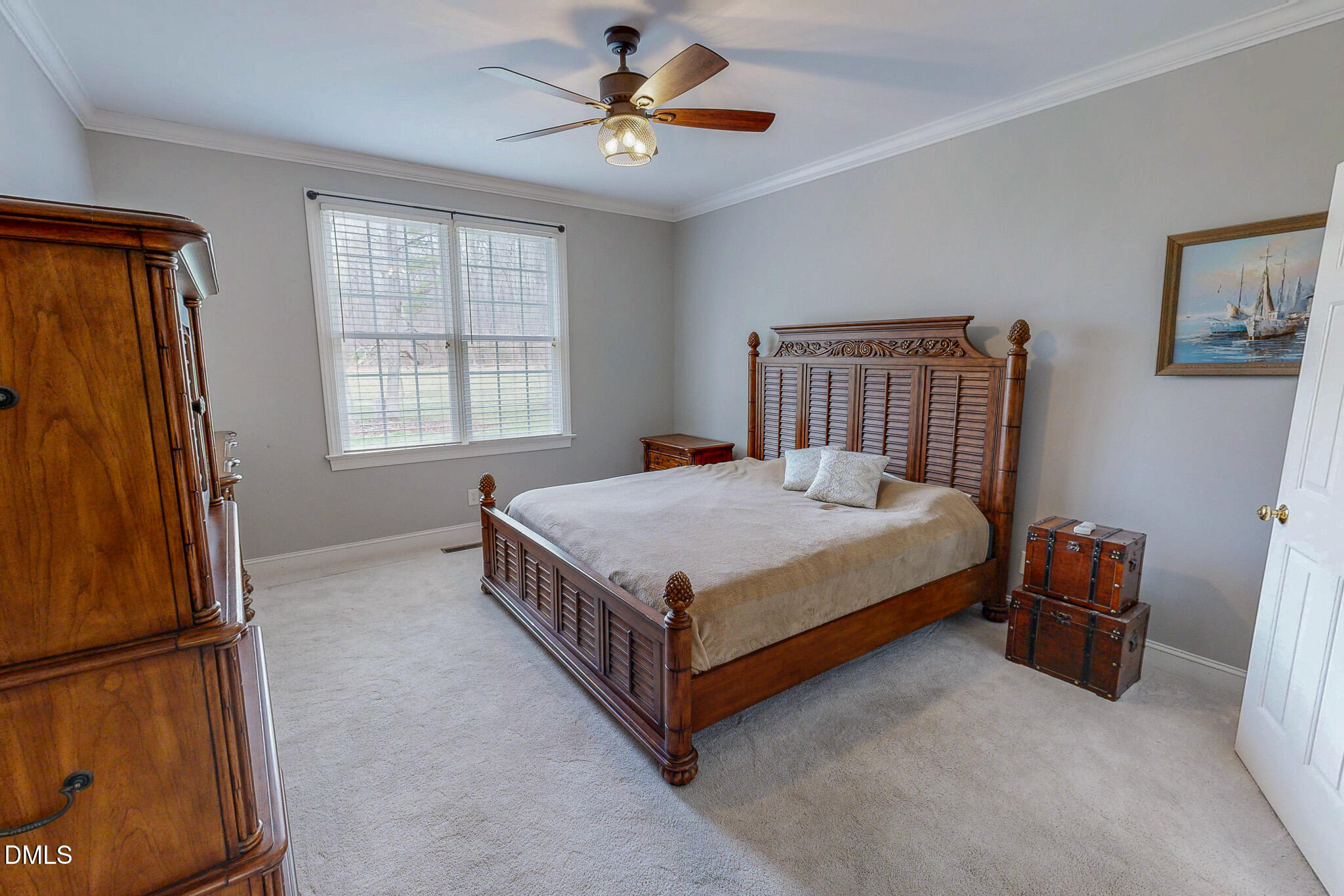 353 Fletcher Ridge Road Timberlake, NC 27583 - Photo 18 of 44 a bed room with a bed and a chandelier