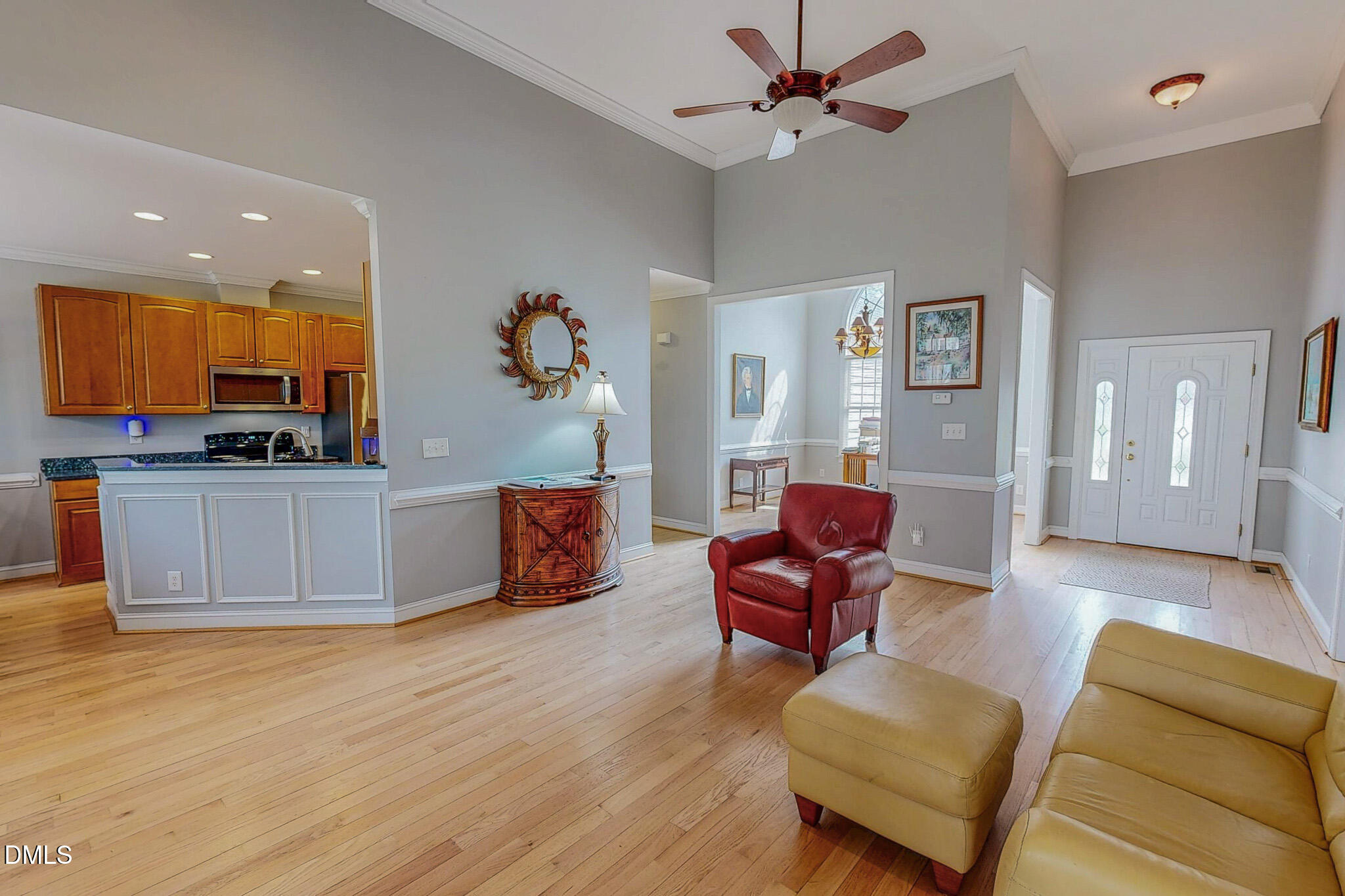 353 Fletcher Ridge Road Timberlake, NC 27583 - Photo 3 of 44 a living room with furniture and a flat screen tv