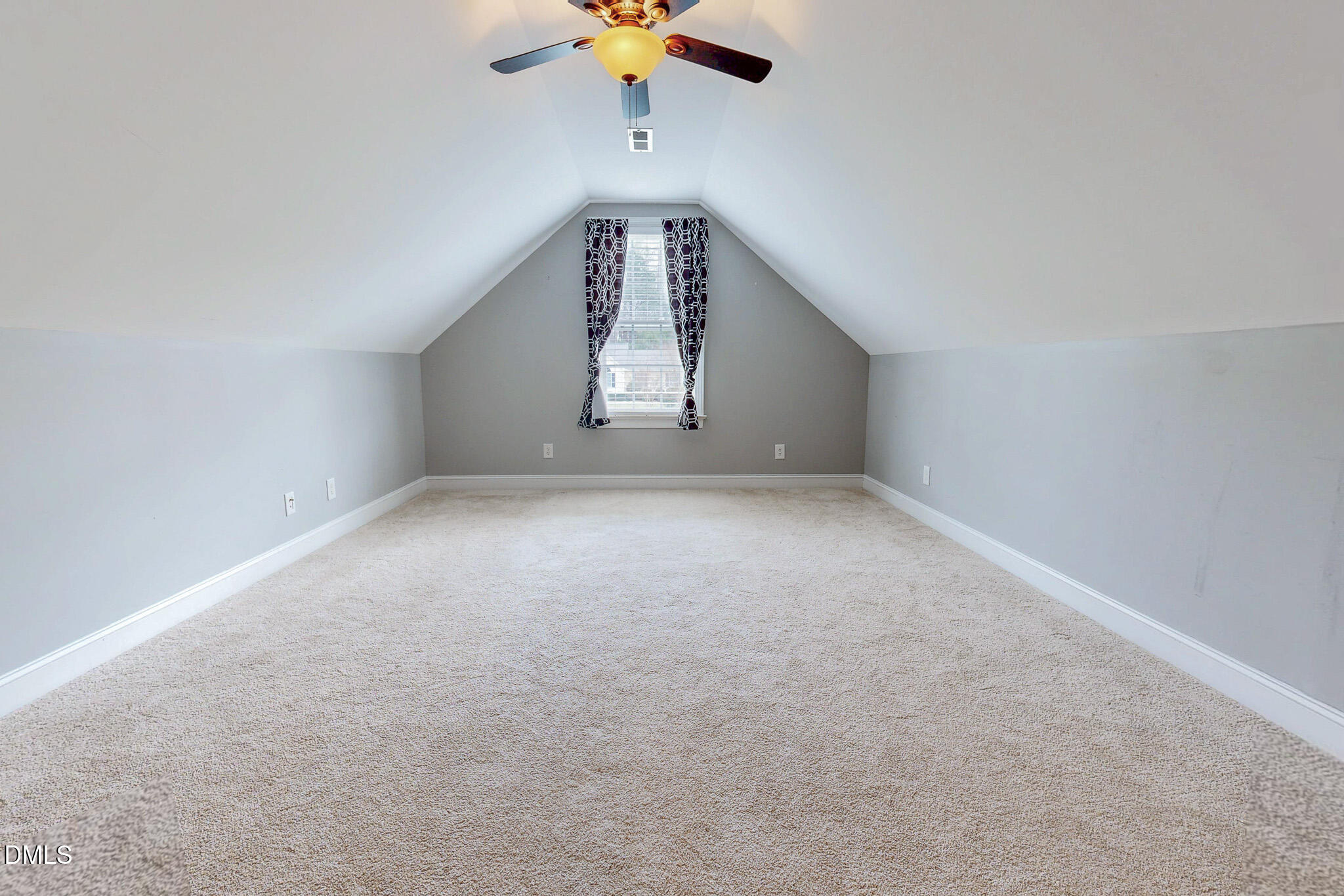 353 Fletcher Ridge Road Timberlake, NC 27583 - Photo 42 of 44 an empty room with a ceiling fan and window