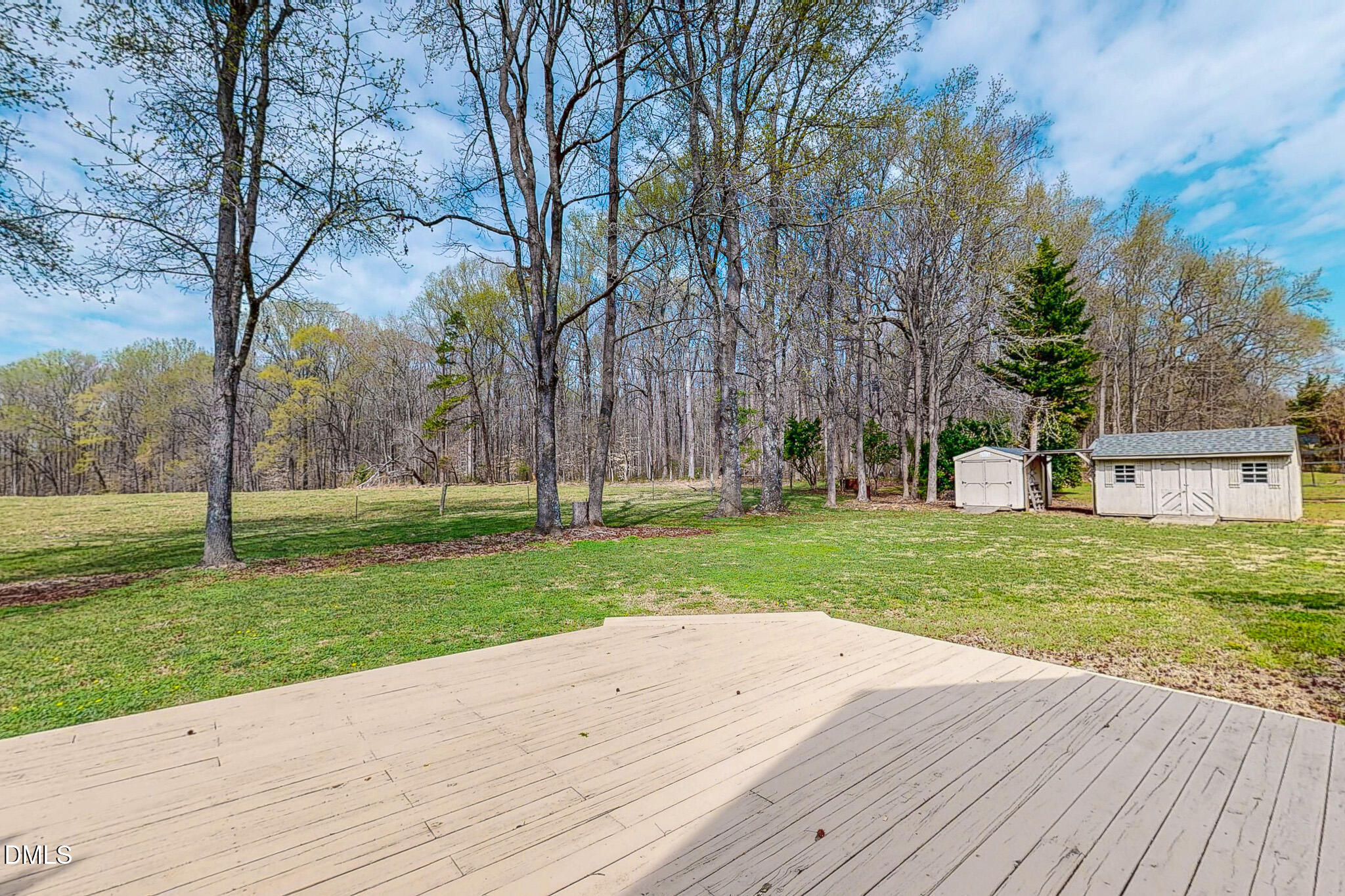 353 Fletcher Ridge Road Timberlake, NC 27583 - Photo 6 of 44 a view of a backyard with large trees