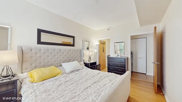 a bedroom with a bed and a dresser