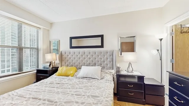 a bedroom with a bed and a dresser