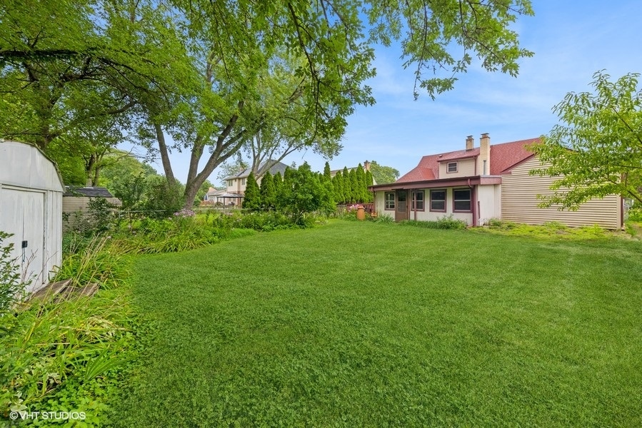 238 West Hickory Road Lombard, IL 60148 - Photo 16 of 17 a view of a yard with a house in the background