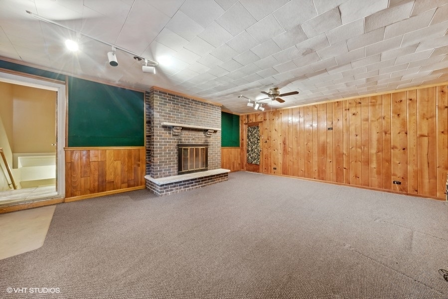 238 West Hickory Road Lombard, IL 60148 - Photo 9 of 17 a view of an empty room with a fireplace