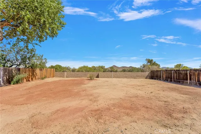 a view of an ocean of a house with a yard