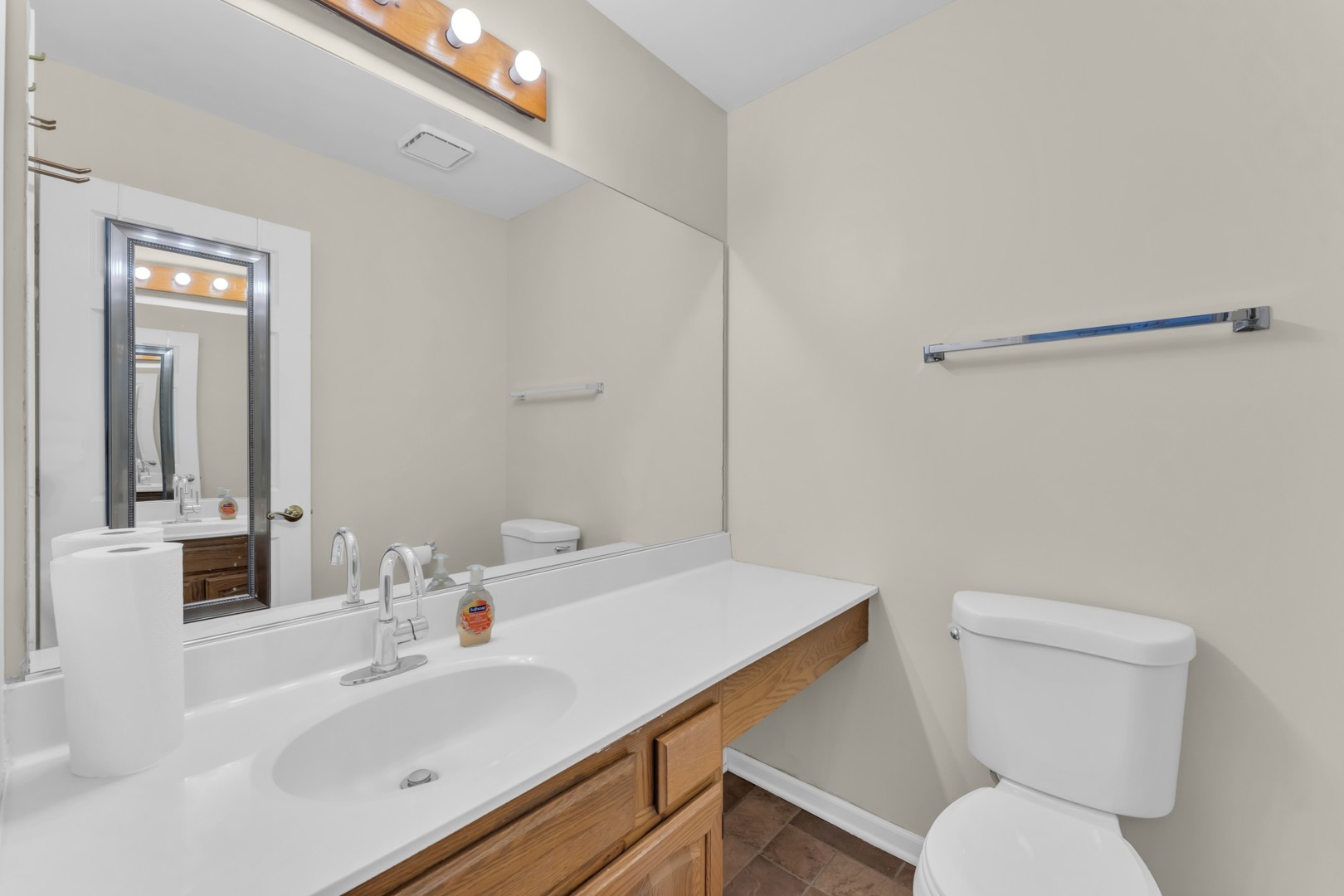 6063 Morningside Court Gurnee, IL 60031 - Photo 12 of 58 a bathroom with a sink a toilet and mirror