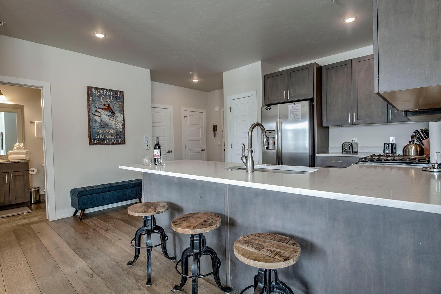 235 La Bonte Street, Unit 108 Dillon, CO 80435 - Photo 11 of 38 a kitchen with a table and chairs in it