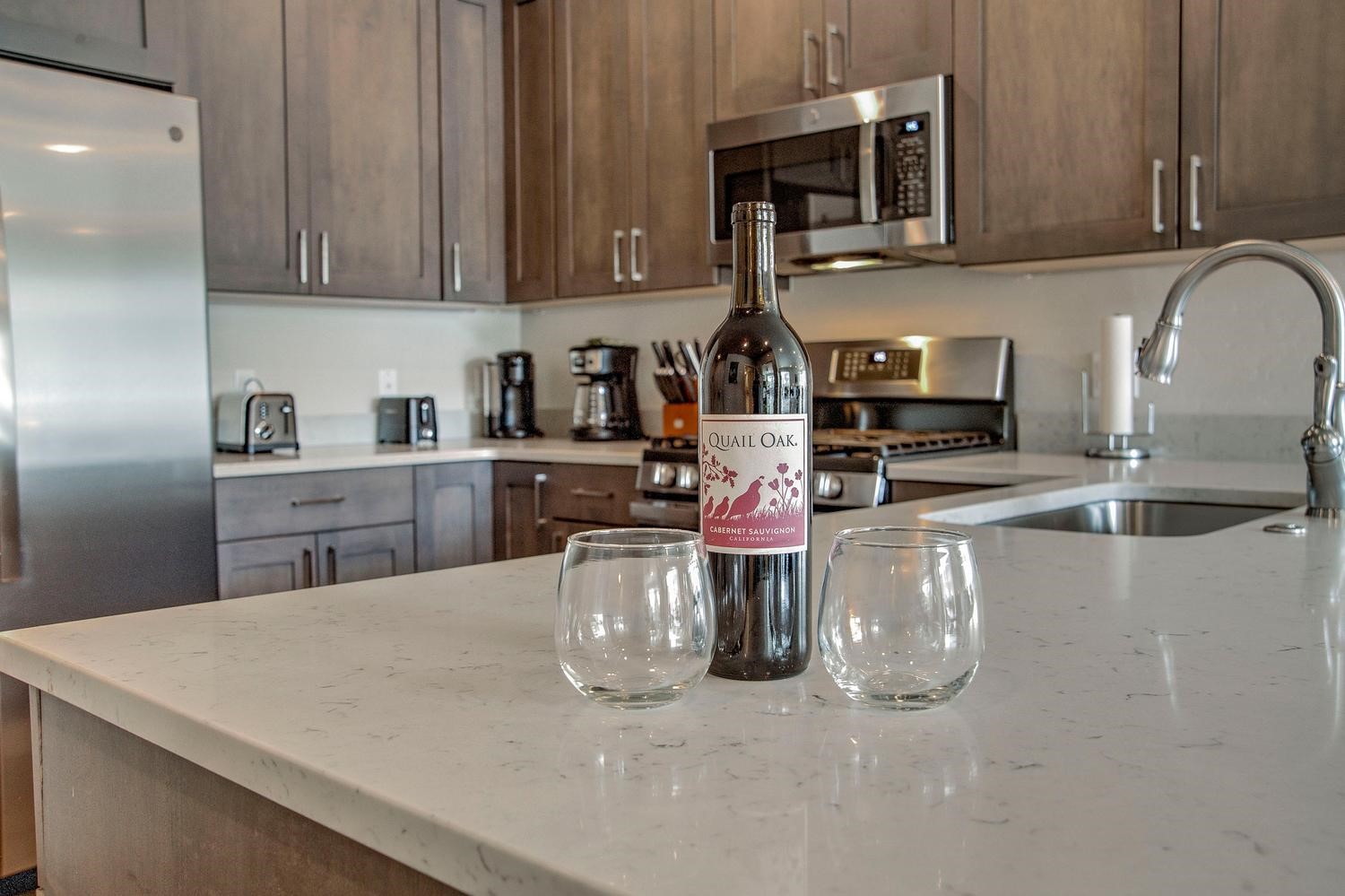 235 La Bonte Street, Unit 108 Dillon, CO 80435 - Photo 12 of 38 a kitchen with a sink a microwave and cabinets