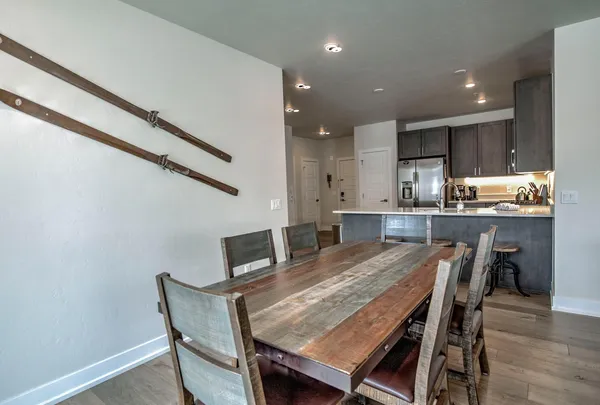a dining room with furniture and window