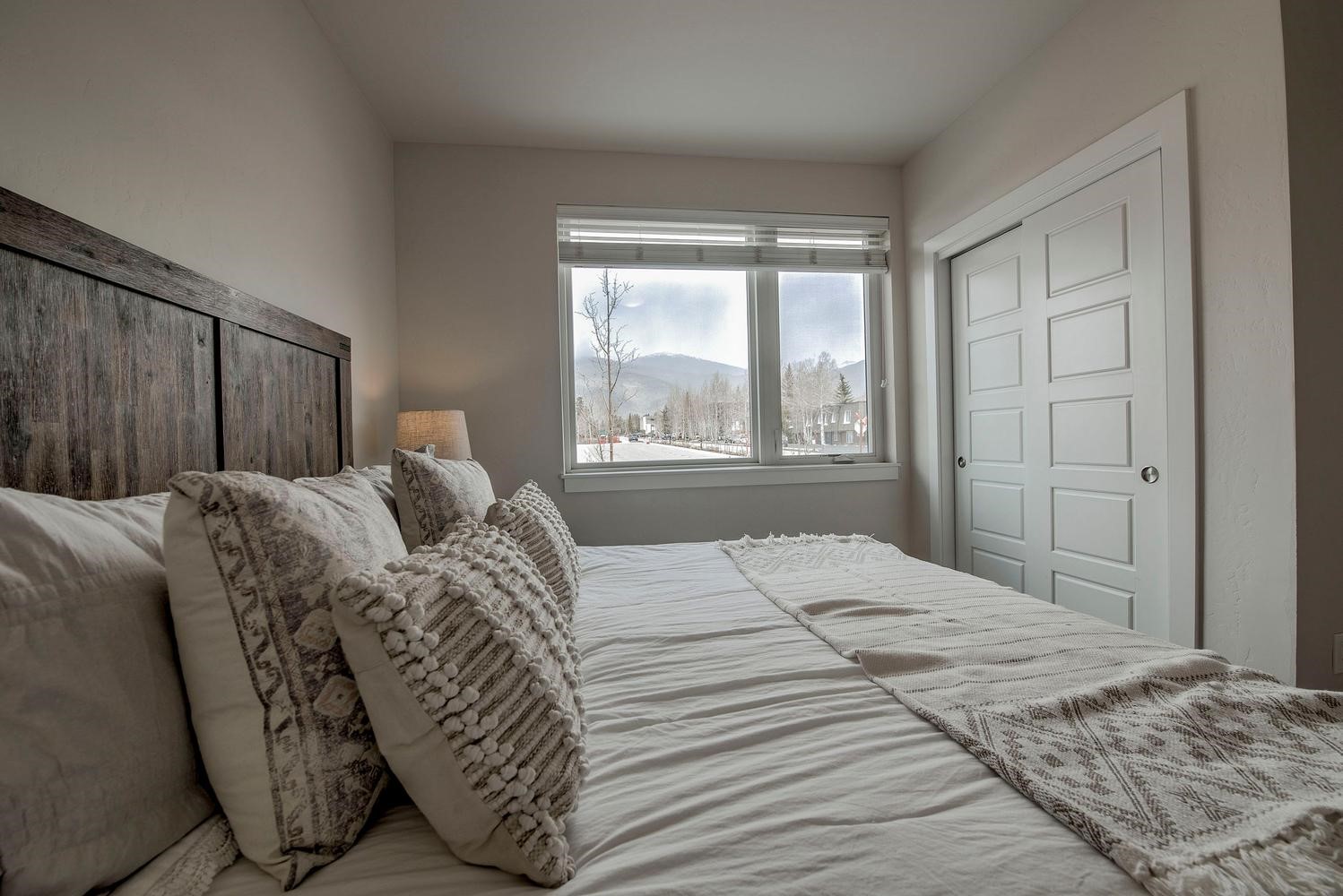 235 La Bonte Street, Unit 108 Dillon, CO 80435 - Photo 22 of 38 a bedroom with a bed and a large window