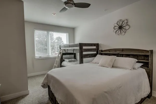 a bedroom with a bed and window