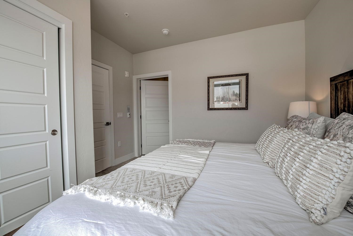 235 La Bonte Street, Unit 108 Dillon, CO 80435 - Photo 23 of 38 a bedroom with a bed and a painting on the wall