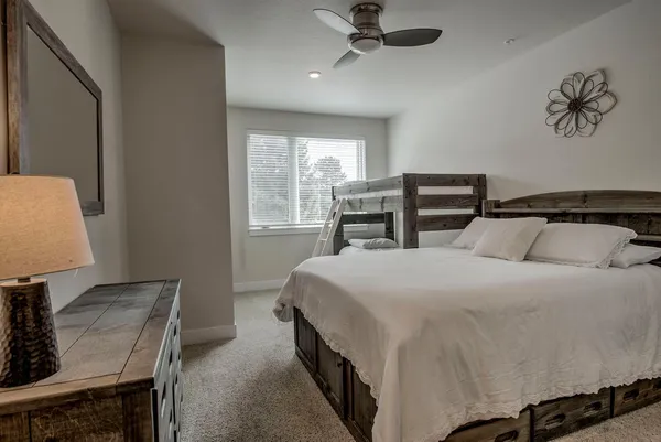 a bedroom with a bed and window