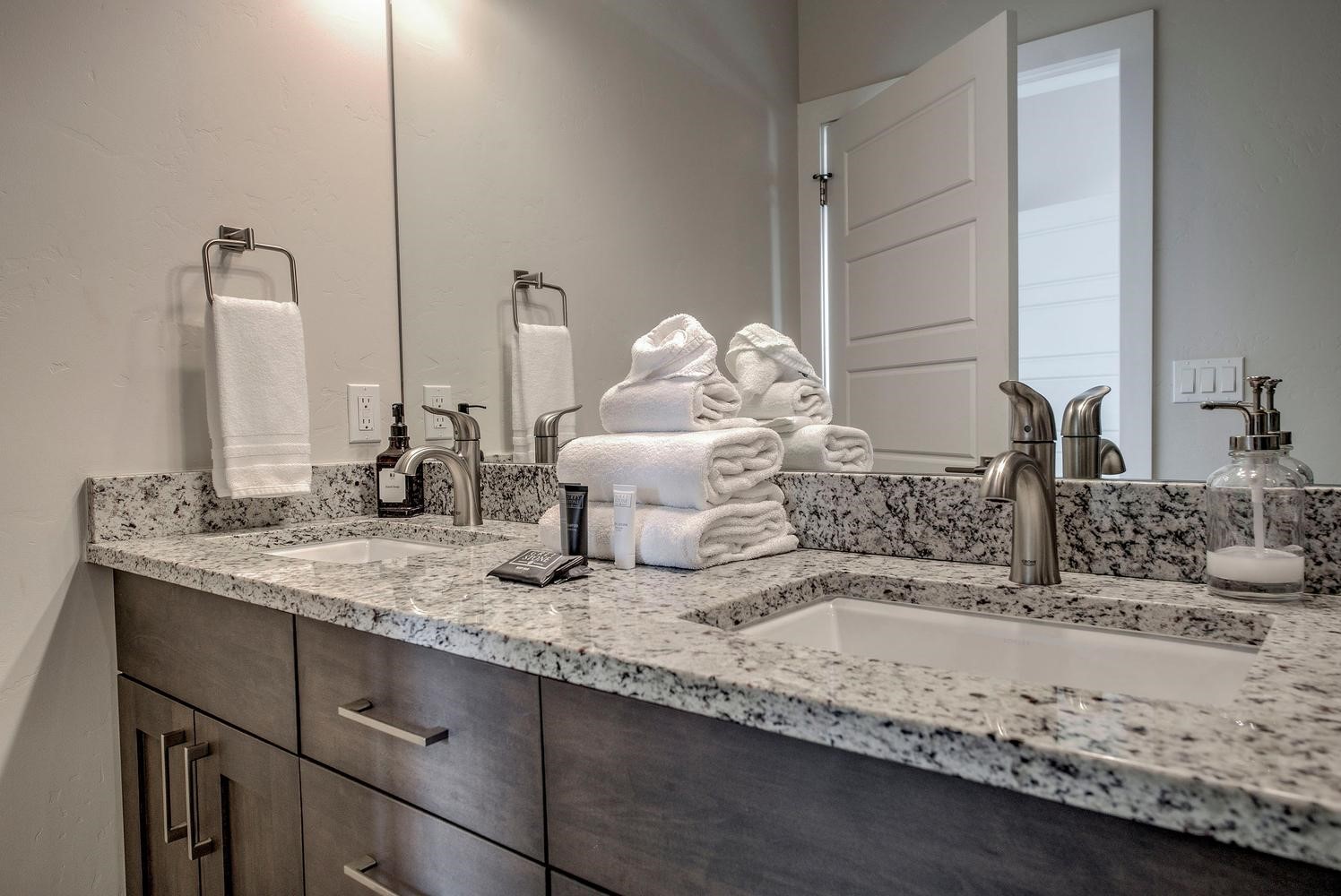 235 La Bonte Street, Unit 108 Dillon, CO 80435 - Photo 25 of 38 a bathroom with a granite countertop sink and a mirror